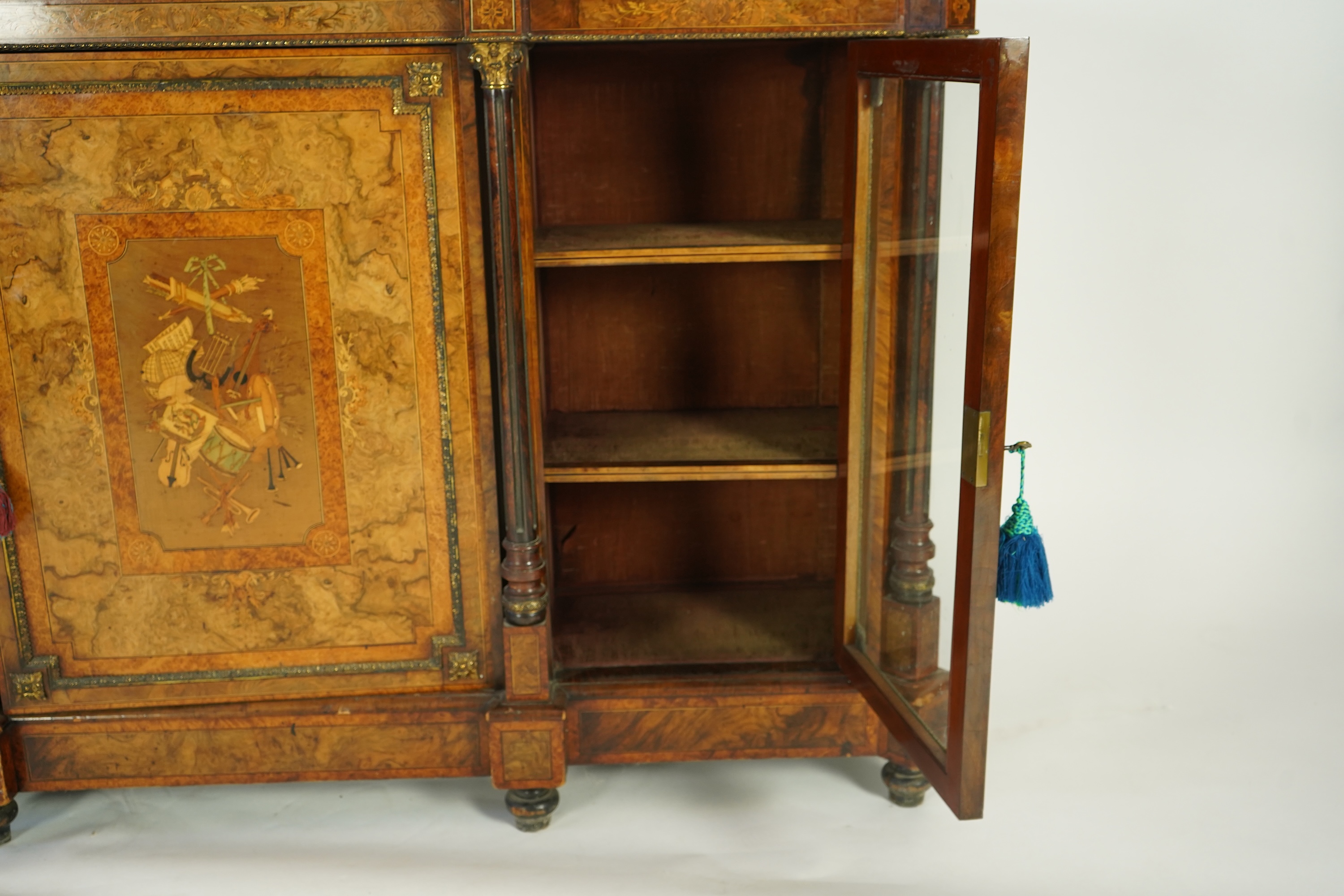 A Victorian birds eye maple banded, gilt metal mounted figured walnut side cabinet